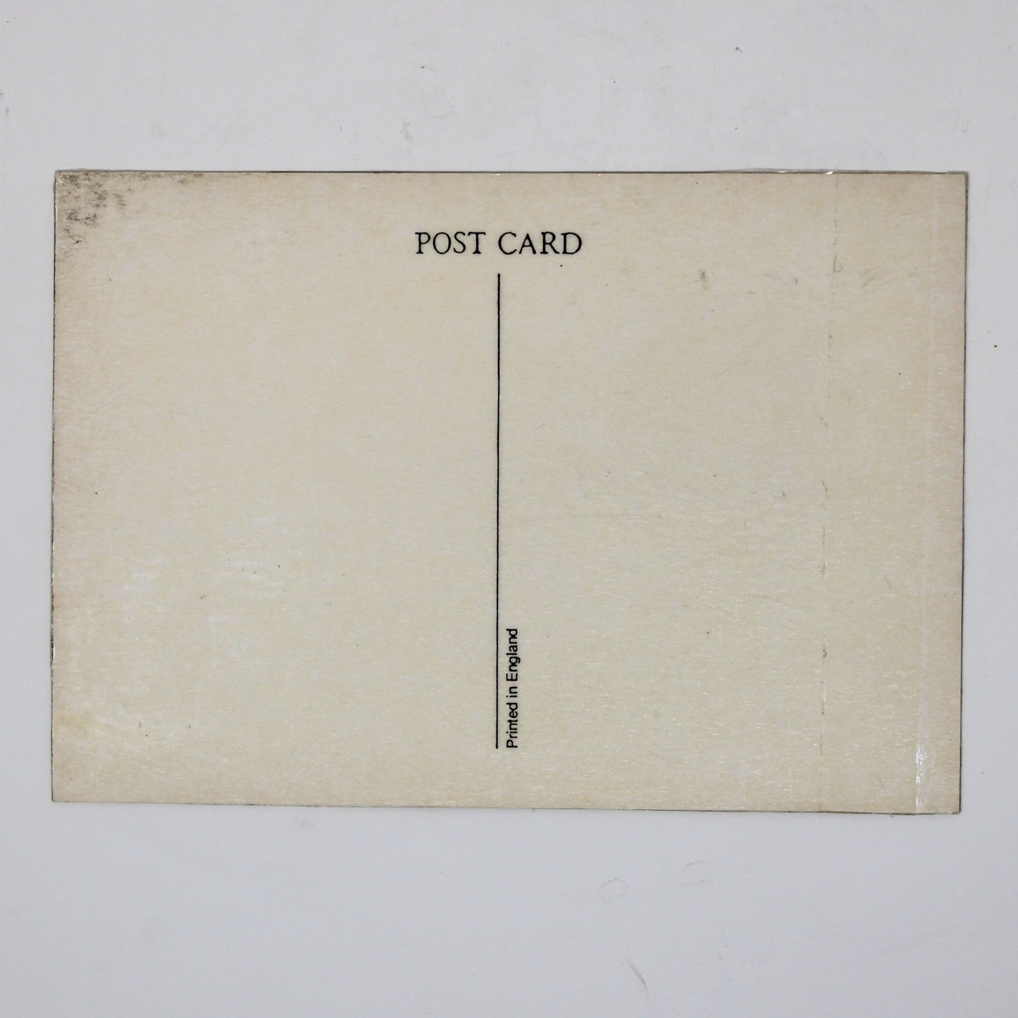 Back view of a vintage postcard featuring The Beatles' 'A Hard Day's Night' album. Back is cream-colored postcard with 'POST CARD' printed at the top and Made in England mark.