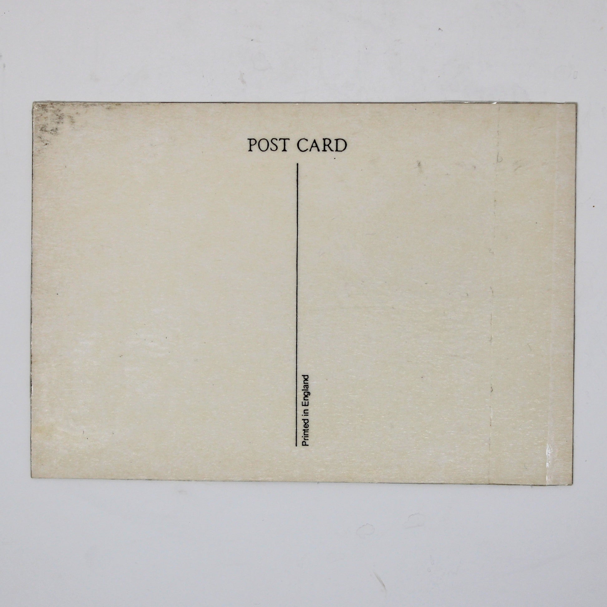 Back view of a vintage postcard featuring The Beatles' 'A Hard Day's Night' album. Back is cream-colored postcard with 'POST CARD' printed at the top and Made in England mark.