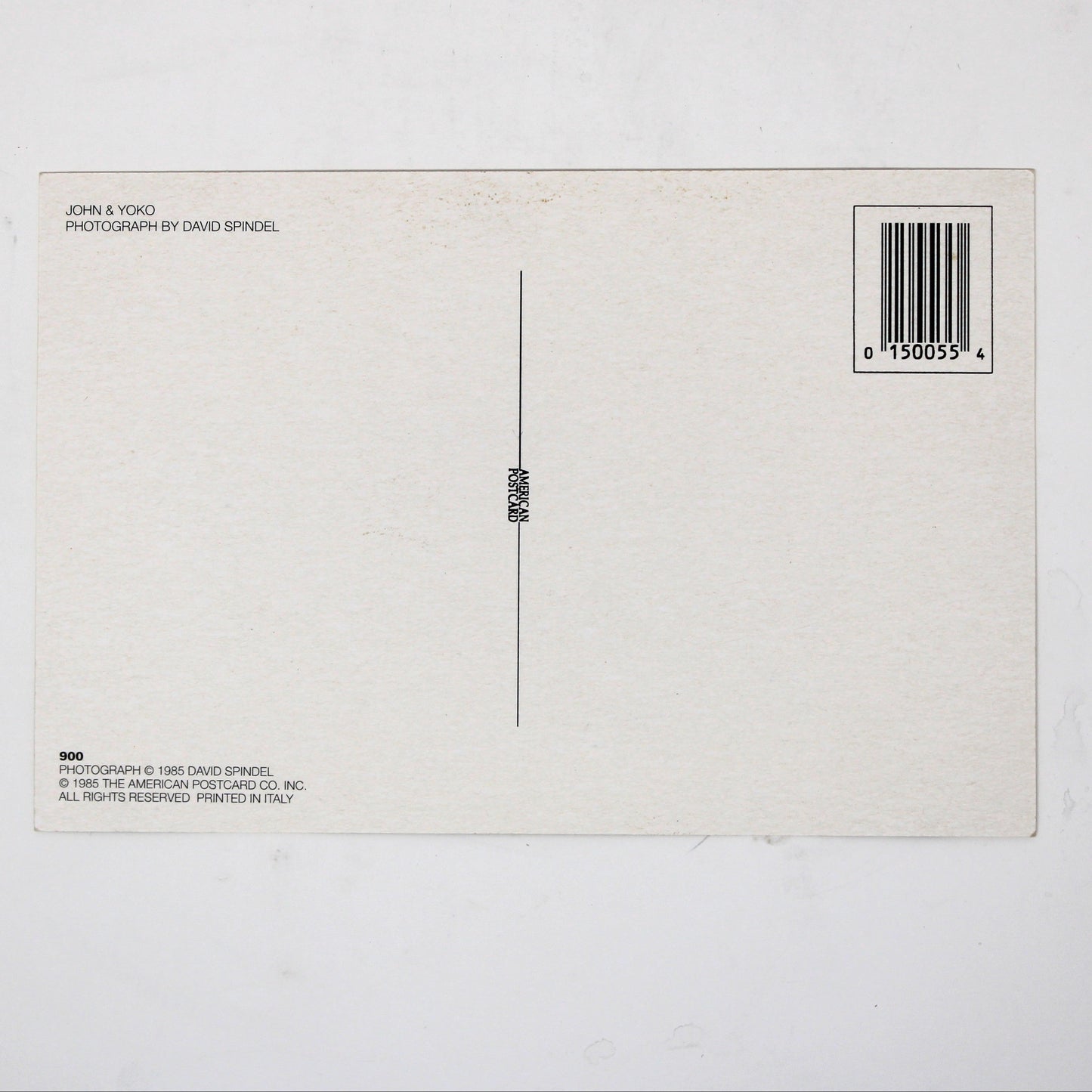 Back view of vintage postcard of John Lennon and Yoko Ono. Photo by David Spindel
