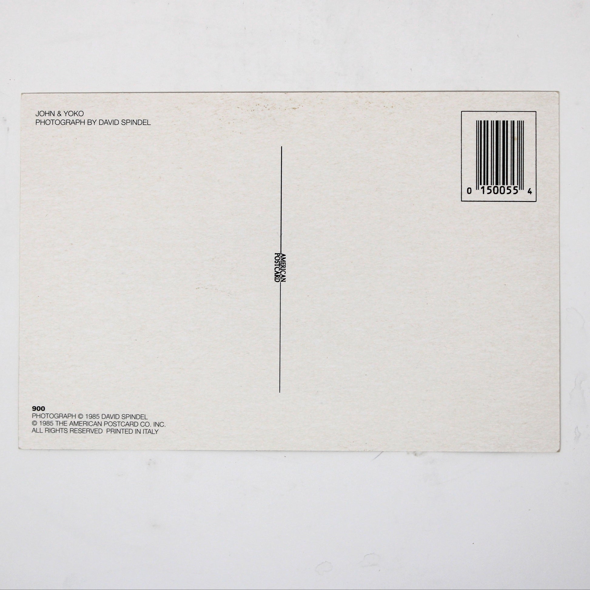 Back view of vintage postcard of John Lennon and Yoko Ono. Photo by David Spindel