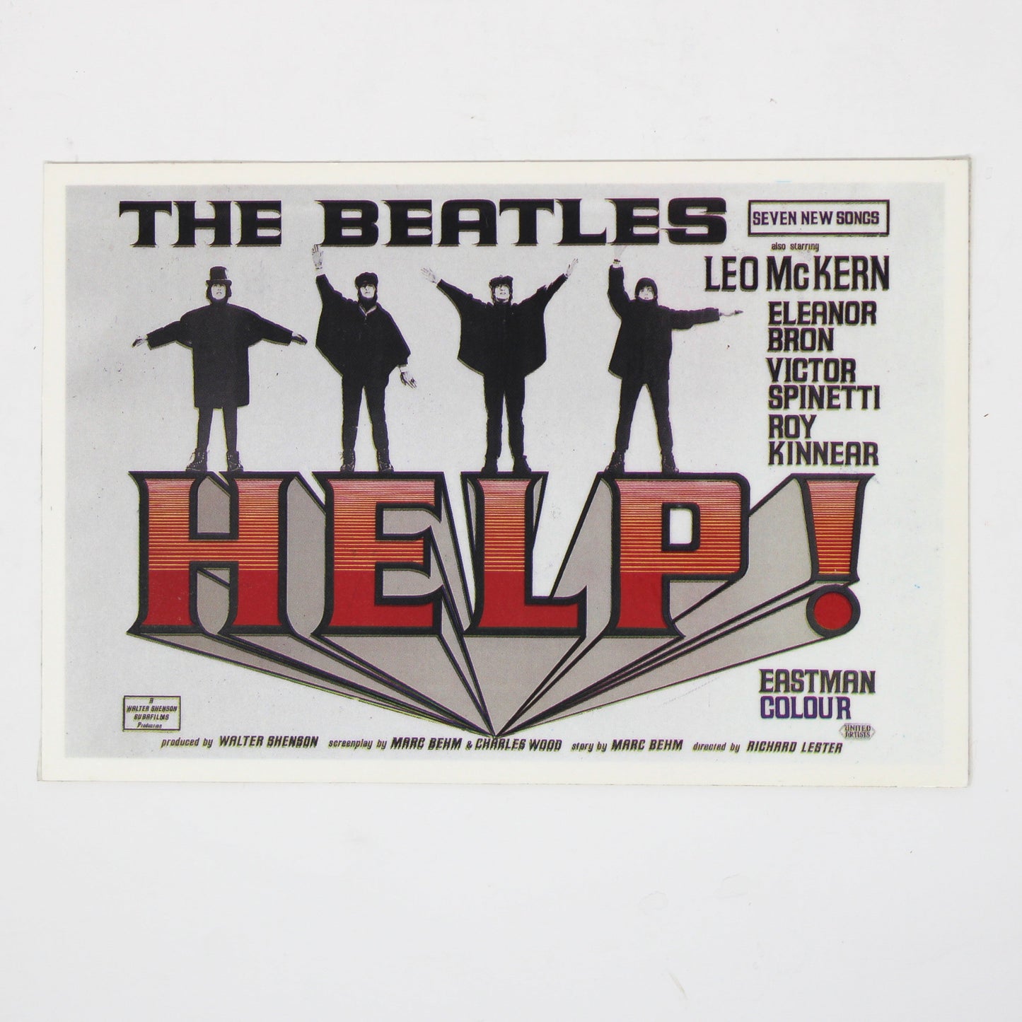 A vintage concert postcard for The Beatles' 'Help!' album, featuring the band members in black silhouettes above large red and black 'HELP!' lettering