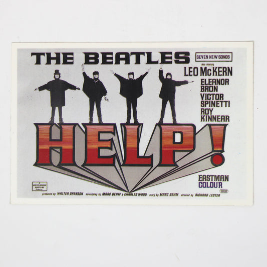 A vintage concert postcard for The Beatles' 'Help!' album, featuring the band members in black silhouettes above large red and black 'HELP!' lettering
