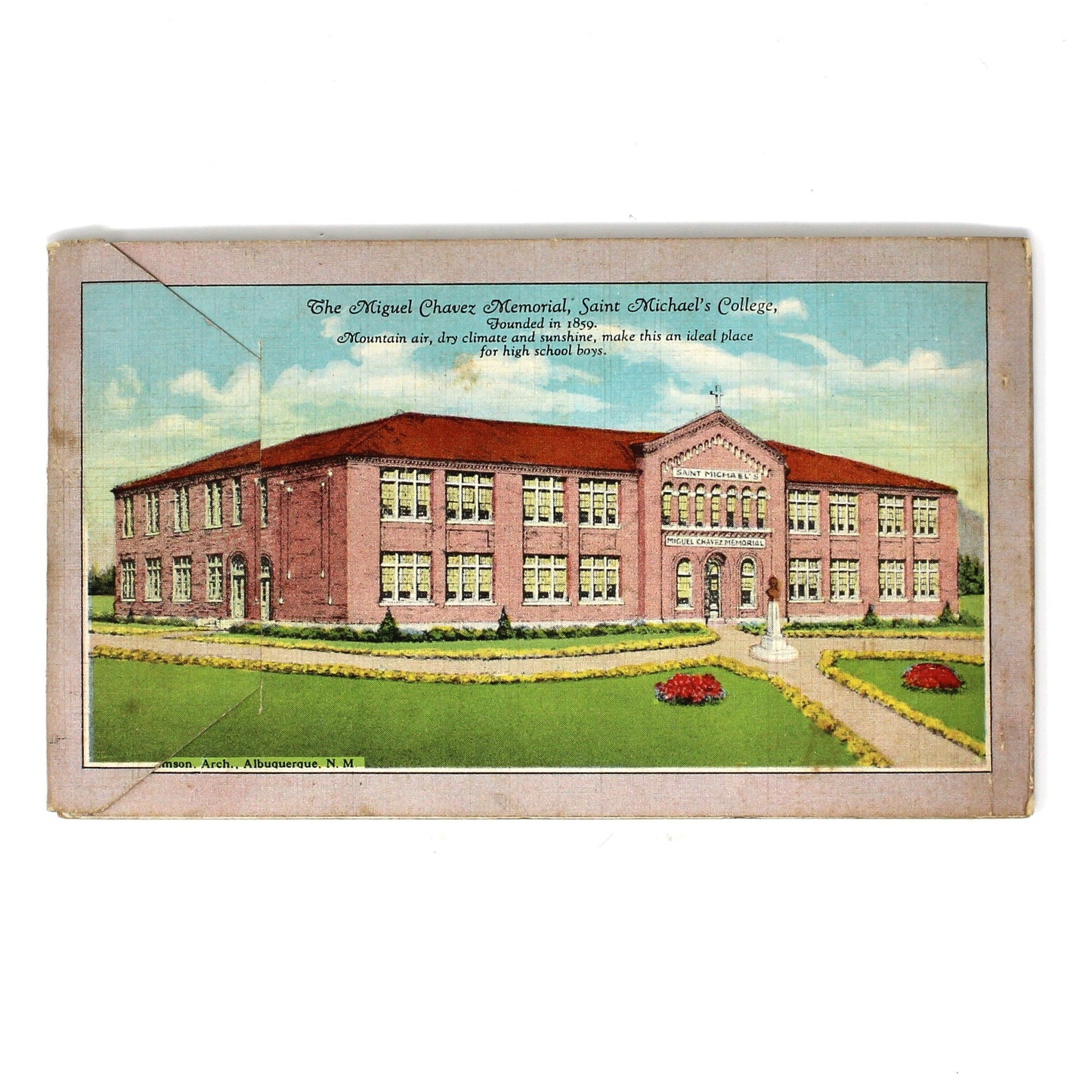 A vintage printed postcard or card featuring an illustration of a large brick building with green lawn and blue sky, centered on a plain white background.