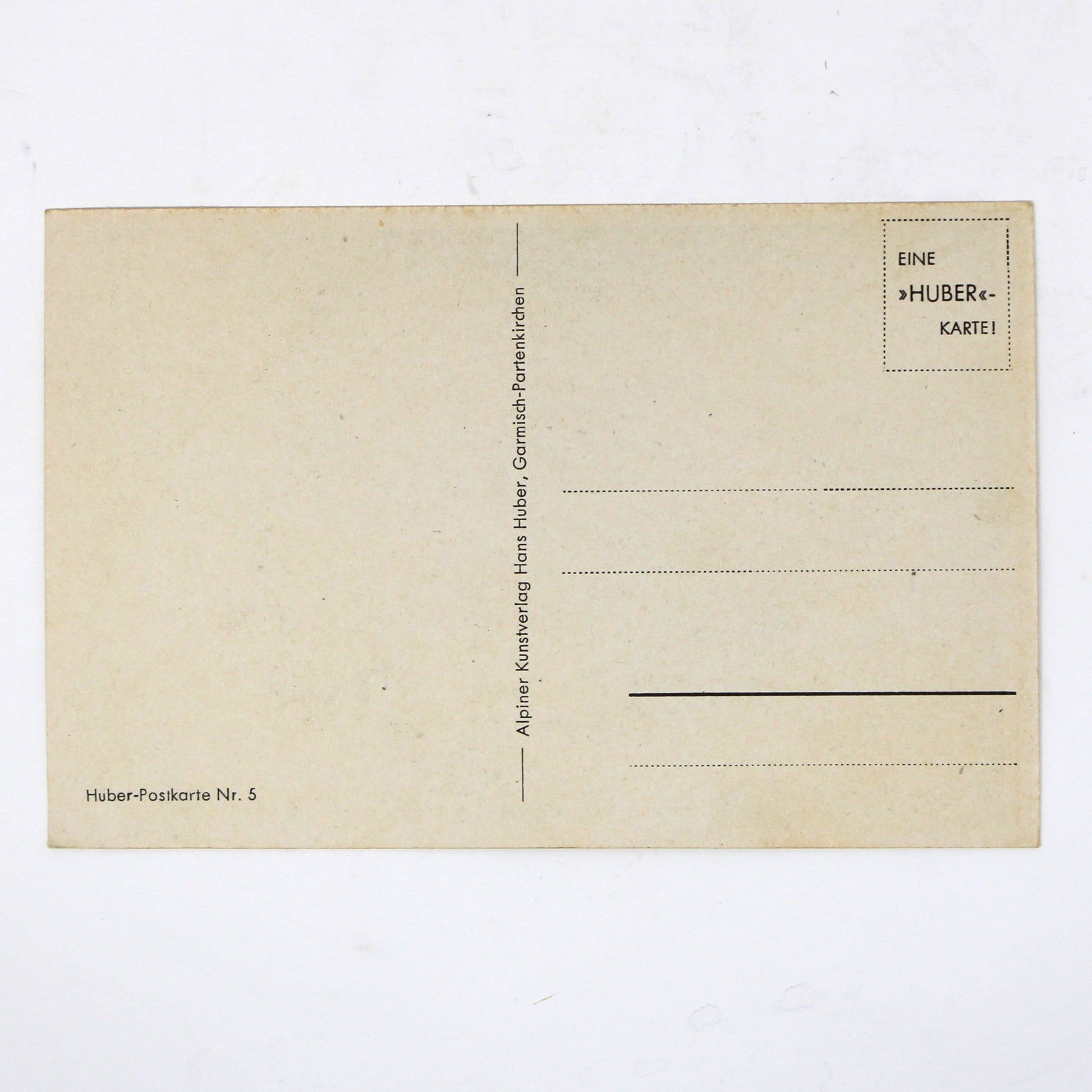 Back view of a vintage postcard with printed lines and text, picture by Hans Huber.