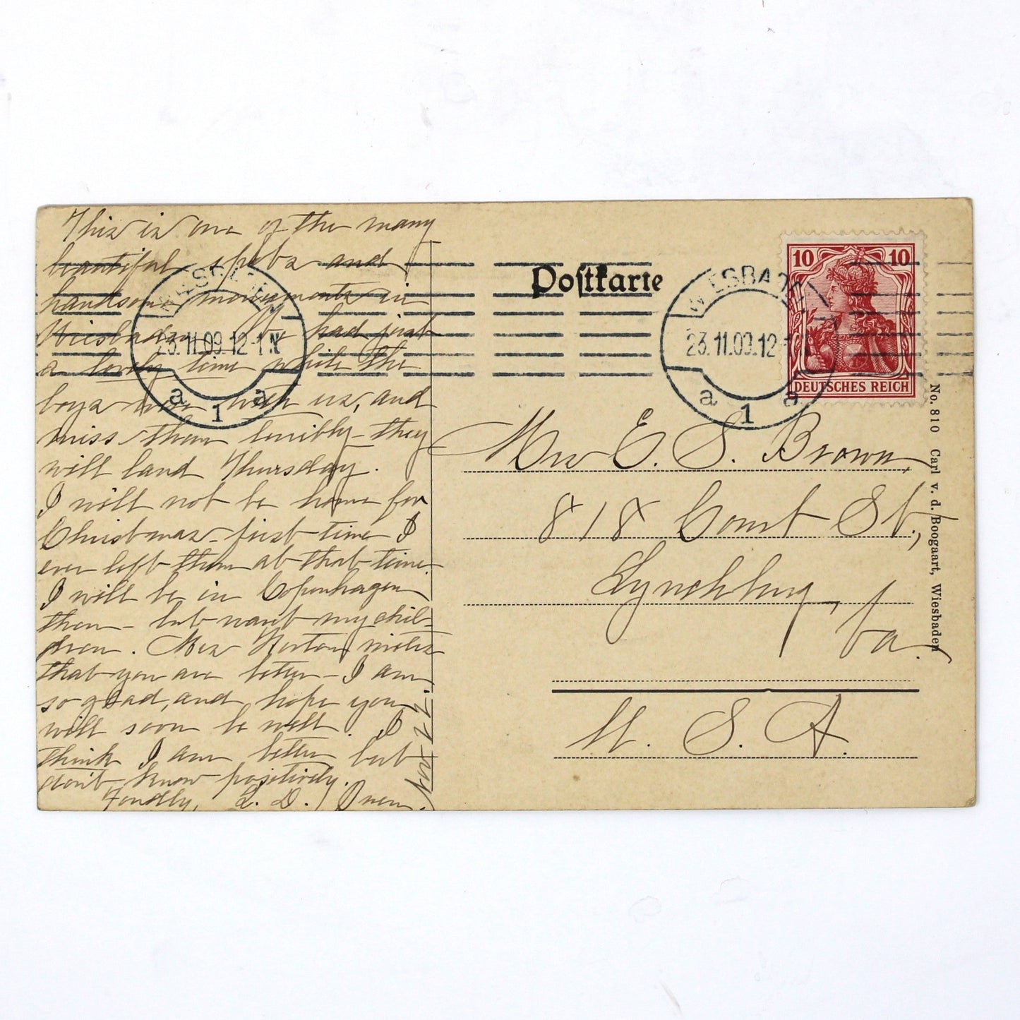 back view of antique German postcard, written in cursive with antique stamp.