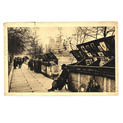 Antique black and white postcard, depicting a Paris street Bouquinistes, Quai de la Tournelle, Yvon. 