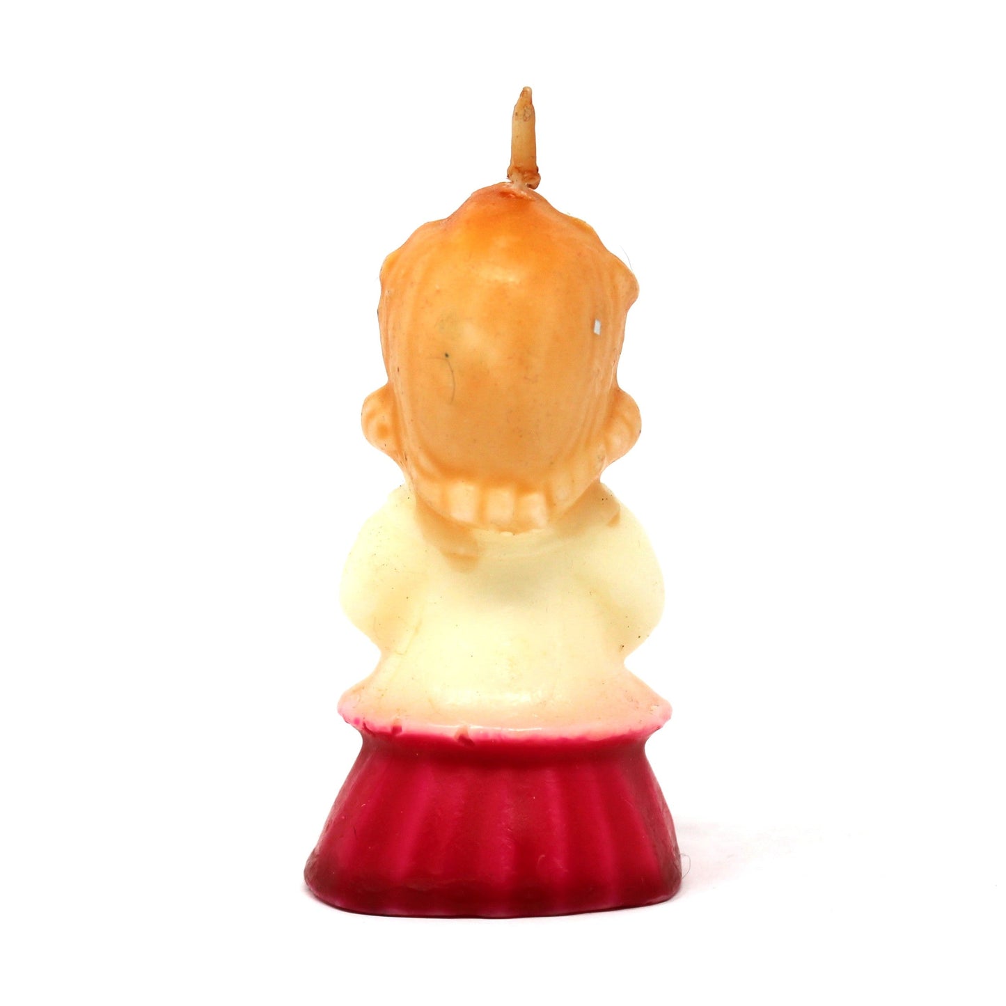 Back view of a vintage Gurley novelty candle shaped like a caroling girl with a white and red dress.