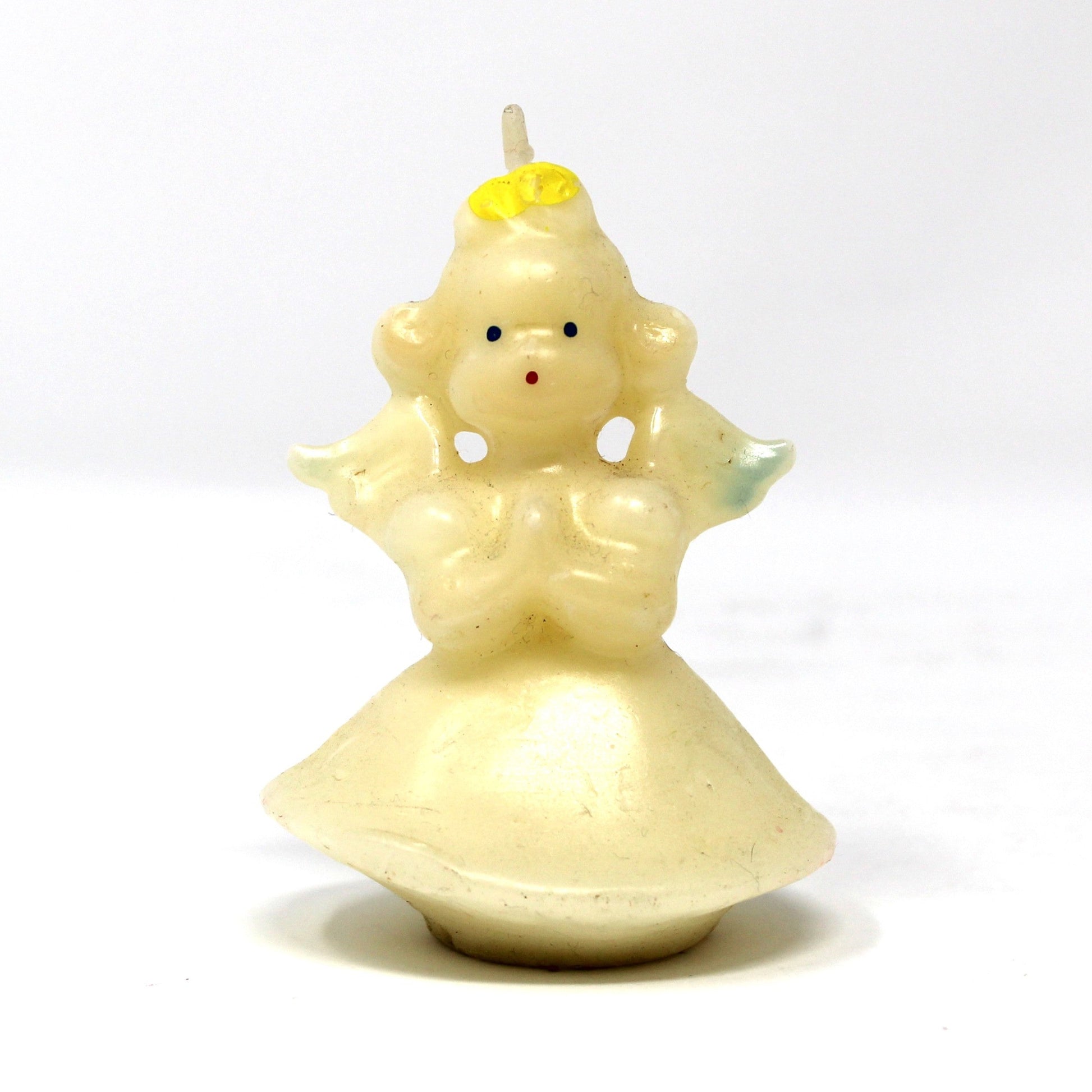 A vintage Gurley angel candle with blond hair and blue wings. 
