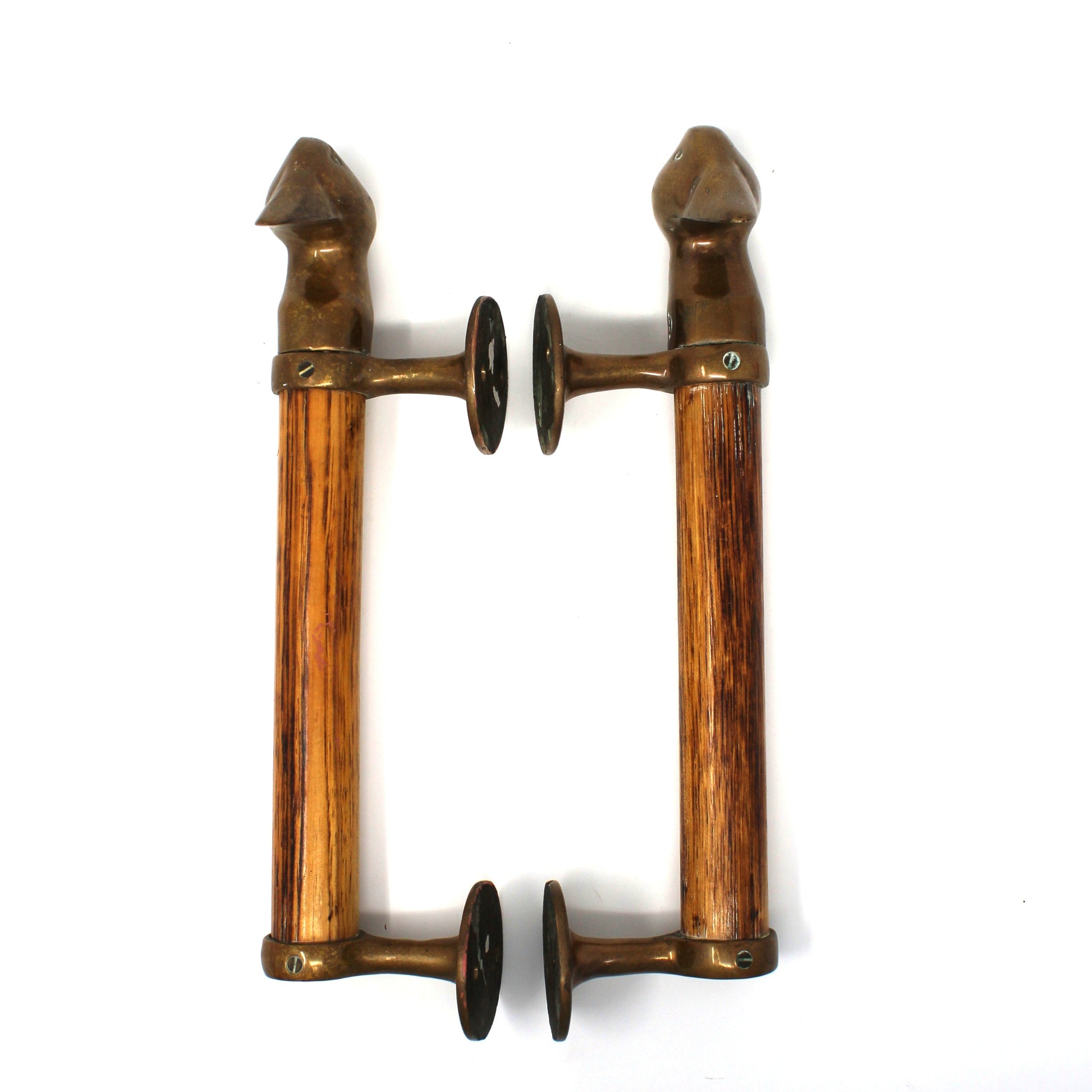 A pair of vintage-style wall door handles made of warm brown wood with bronze metal fittings and dark circular accents, shown against a plain white background.