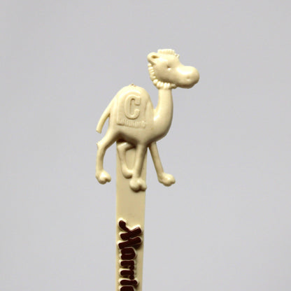 A vintage swizzle stick, cream-colored with a camel figure on top, from Marriott's Camelback Inn in Scottsdale.