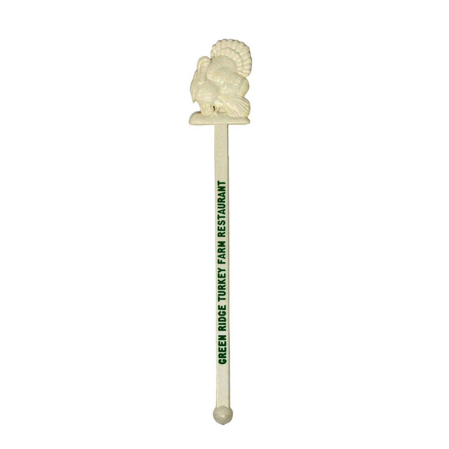 An off-white plastic cocktail stirrer with a carved lion head topper and green printed text reading 'GREEN ROSE TROUT FARM RESTAURANT', shown on a plain white background.