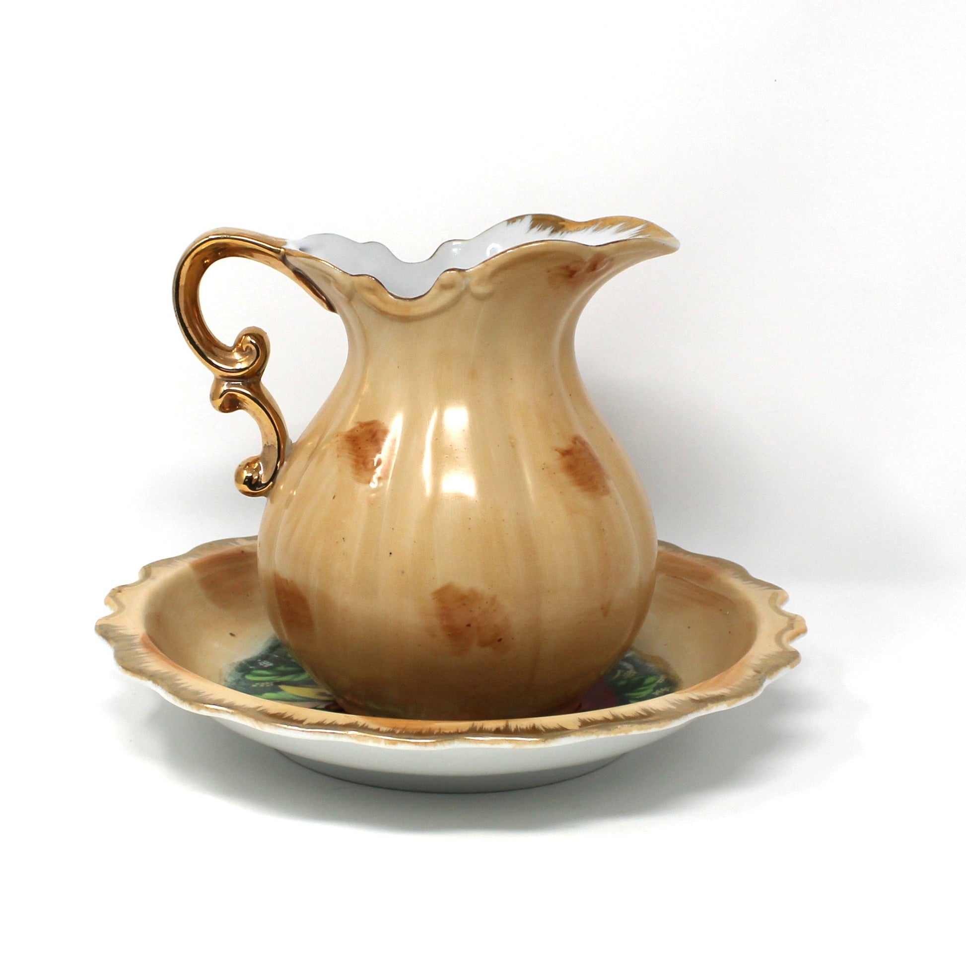 Back view of a vintage ceramic pitcher and basin set hand painted in Fall colors.