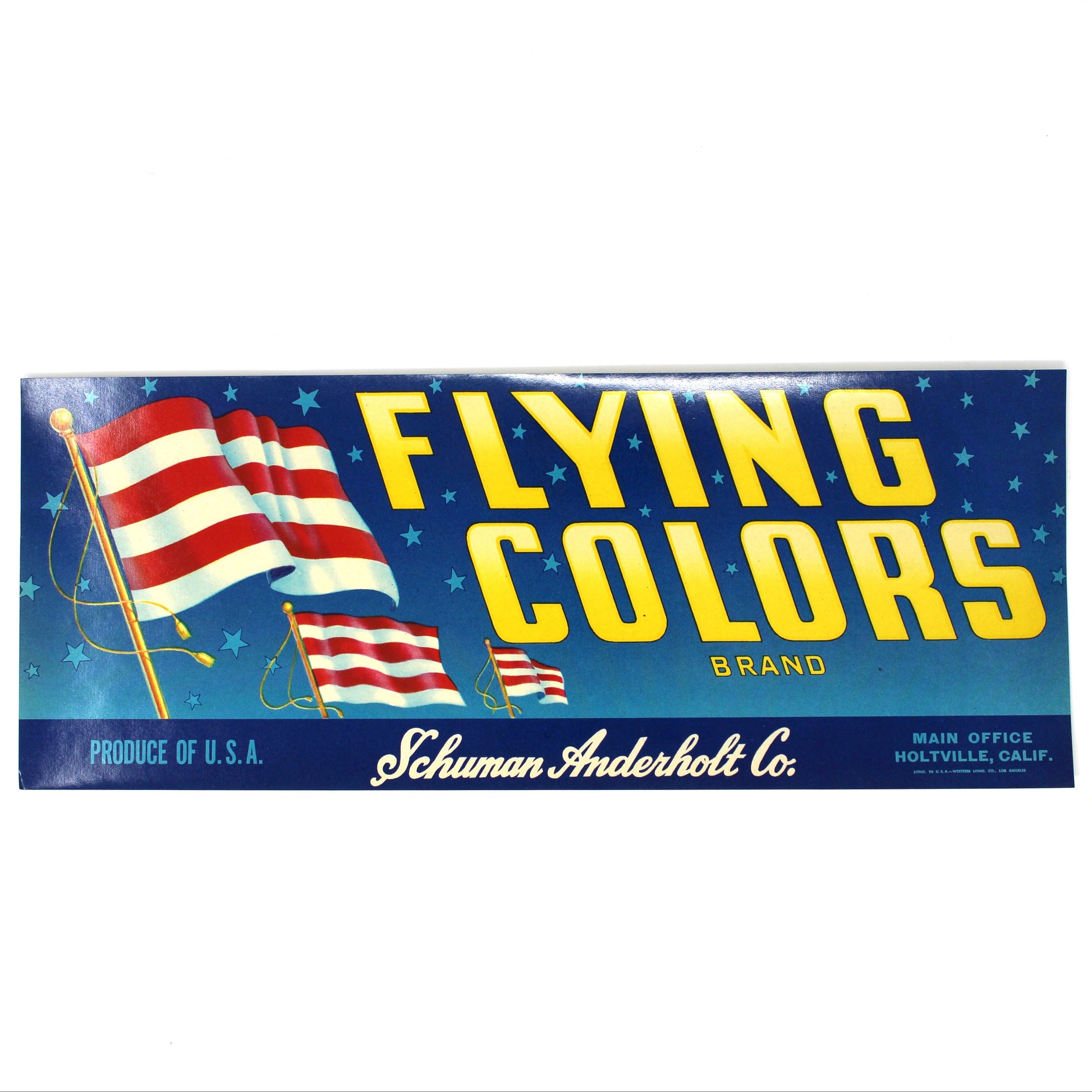 A vintage paperboard sign for the Flying Colors brand, featuring a blue starry background, yellow lettering, and American flag graphics, with 'Schuman Anderholt Co.' printed at the bottom.