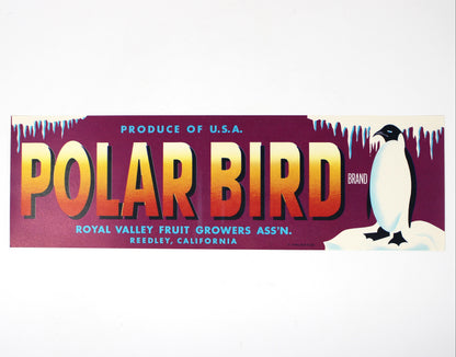 A rectangular vintage-style label or sticker for Polar Bird, featuring large orange-to-yellow gradient lettering on a dark purple background, with a penguin illustration on the right and text reading 'Produce of U.S.