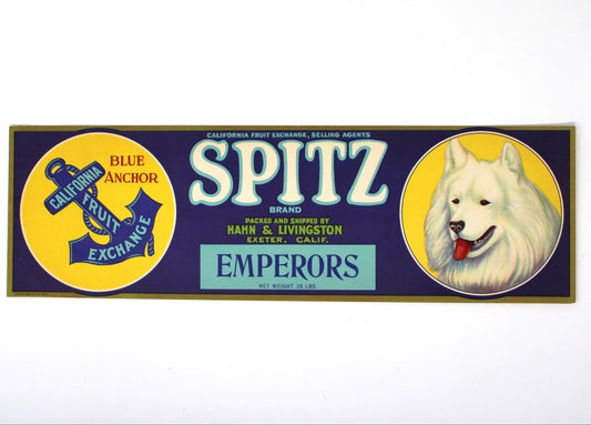 A rectangular vintage Spitz Emperors beer label with a navy blue background, yellow circular medallions, white and blue lettering, and a white dog portrait on the right.