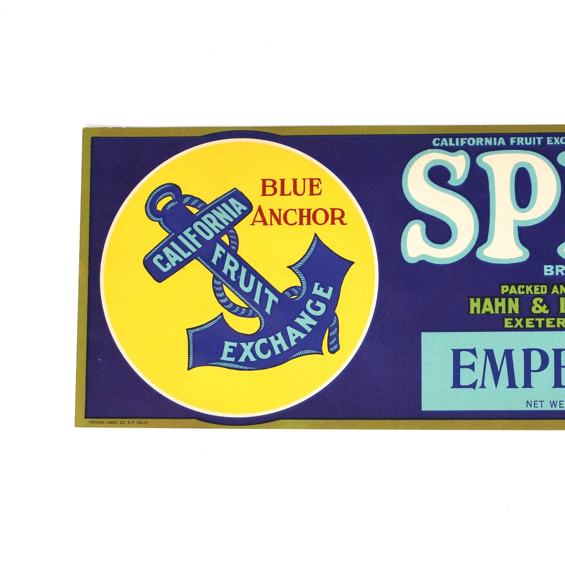 A vintage Spitz Emperors fruit brand crate label. The label features a dark blue field with large white 'SPITZ' lettering, a yellow circular emblem with an anchor and the words 'Blue Anchor Fruit Exchange,' a portrait of a white dog on the right, and 'Emperors' in a light blue box near the bottom.
