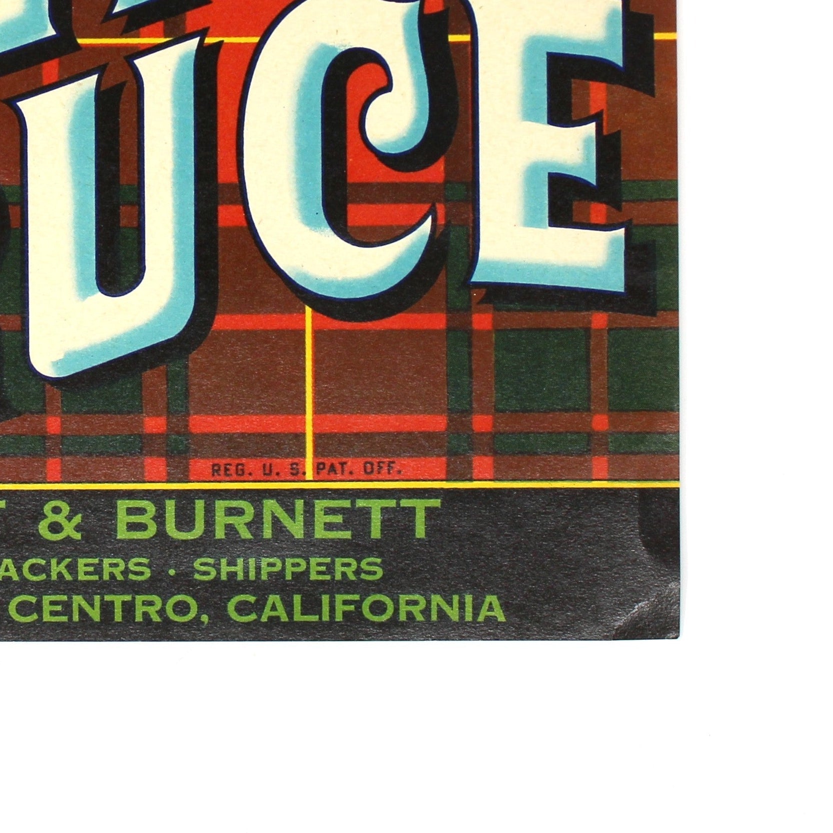 A vintage Royal Bruce select vegetables crate label, featuring a red and green tartan pattern, a gold crest, and large white and blue lettering