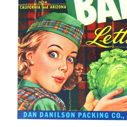 Vintage-style Bonnie Babe lettuce packaging artwork with large white block letters, a plaid background, an illustrated woman in a green hat, and a green cabbage held in her hands. Visible text includes 'Bonnie Babe Lettuce' and 'Dan Danilson Packing Co.