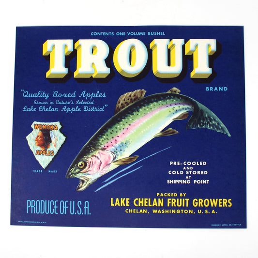 A vintage-style Trout brand fruit crate label or poster featuring a blue background, large yellow 'TROUT' text, and an illustrated fish, photographed against a plain white background.