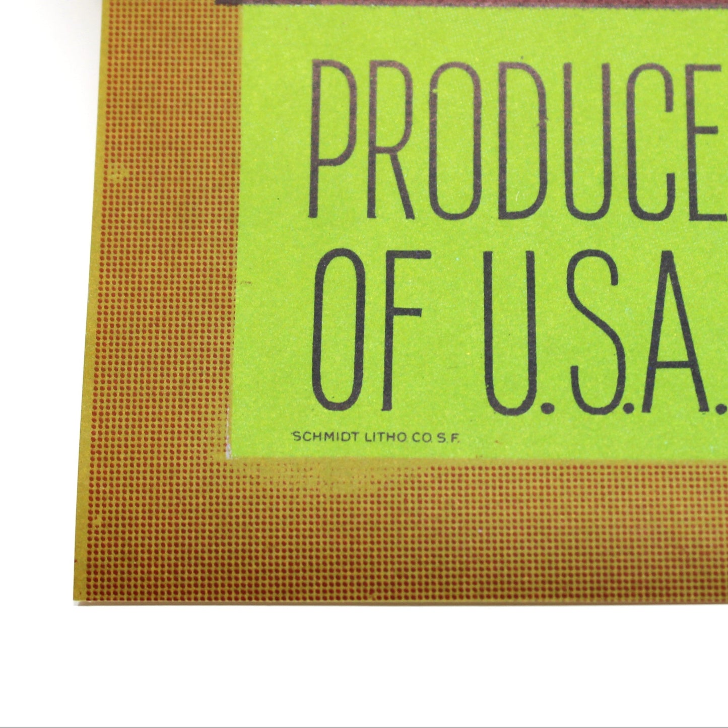 Close-up corner of a vintage-style produce sign or poster showing 'CONNELL BROS.' and 'PRODUCE OF U.