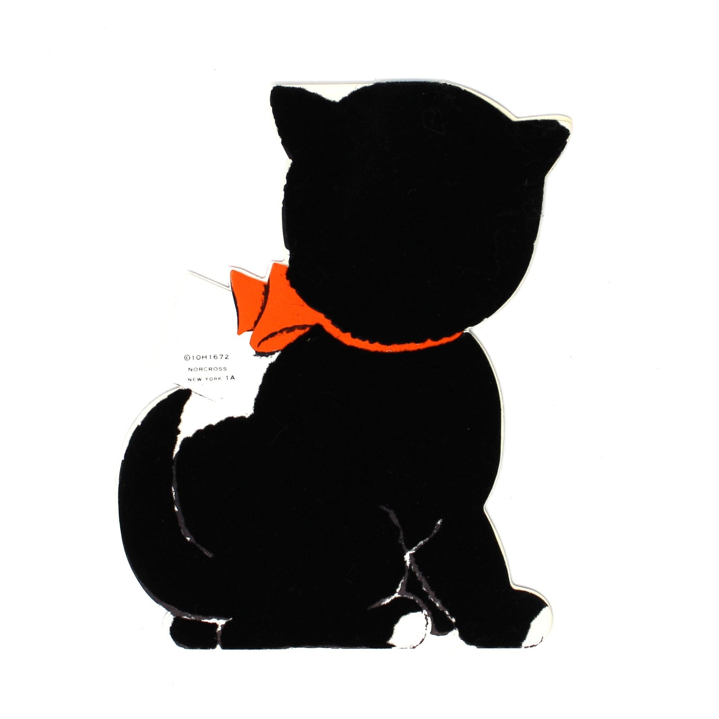 Back view of a vintage Halloween card, cartoon-style black cat with orange eyes and an orange bow tie