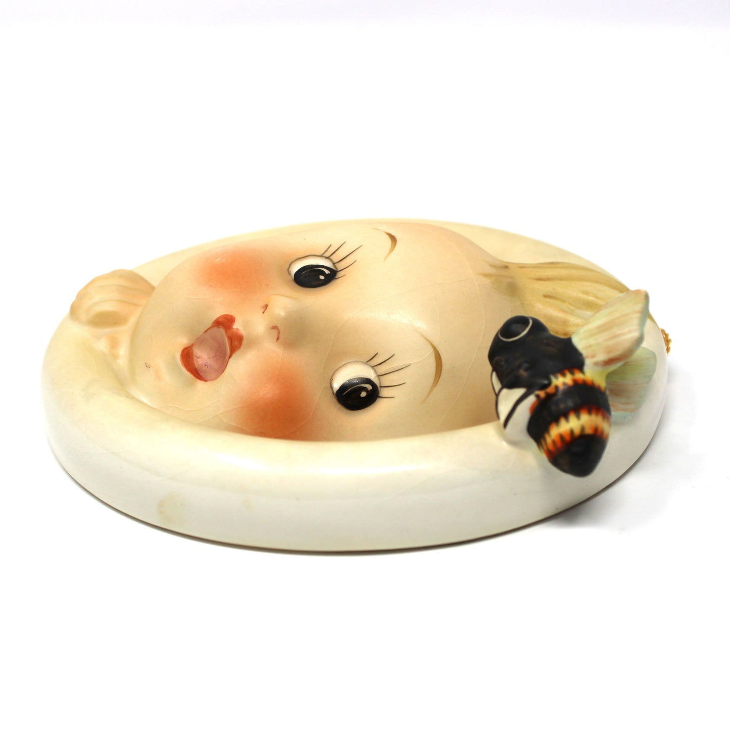 Side view of vintage Hummel Wall Plaque: Goebel Ba-Bee Ring Boy (30/0A), TMK-3 Stylized Bee, West Germany