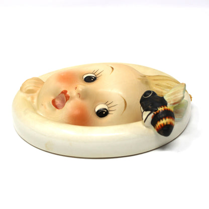 Side view of vintage Hummel Wall Plaque: Goebel Ba-Bee Ring Boy (30/0A), TMK-3 Stylized Bee, West Germany