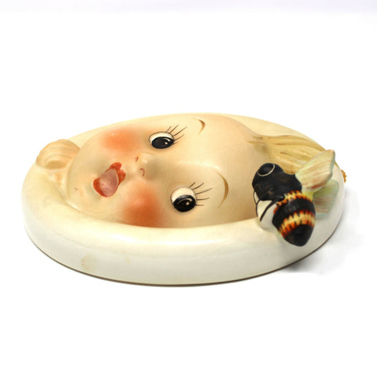 Side view of vintage Hummel Wall Plaque: Goebel Ba-Bee Ring Boy (30/0A), TMK-3 Stylized Bee, West Germany