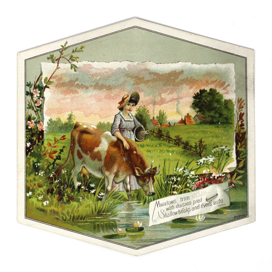 A vintage Trade Card, hexagonal decorative print featuring an illustrated pastoral scene with a woman, a cow, flowers, and a small stream for Lion Coffee.
