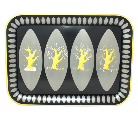 A decorative rectangular tray with rounded corners, featuring a black center, four vertical gray oval panels with yellow stylized four seasons tree designs, and a yellow border with a white dotted pattern.