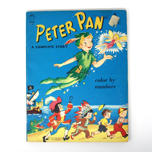 Vintage Peter Pan coloring book, featuring Peter Pan flying over a beach with the Tinker Bell and other characters.  Unused dated 1961