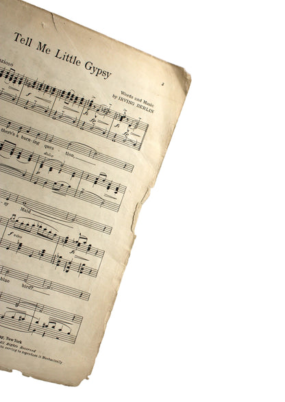 A vintage sheet music page for 'Tell Me Little Gypsy' by Marion Mears, featuring aged yellowed paper with black musical notation, shown against a plain light gray background.