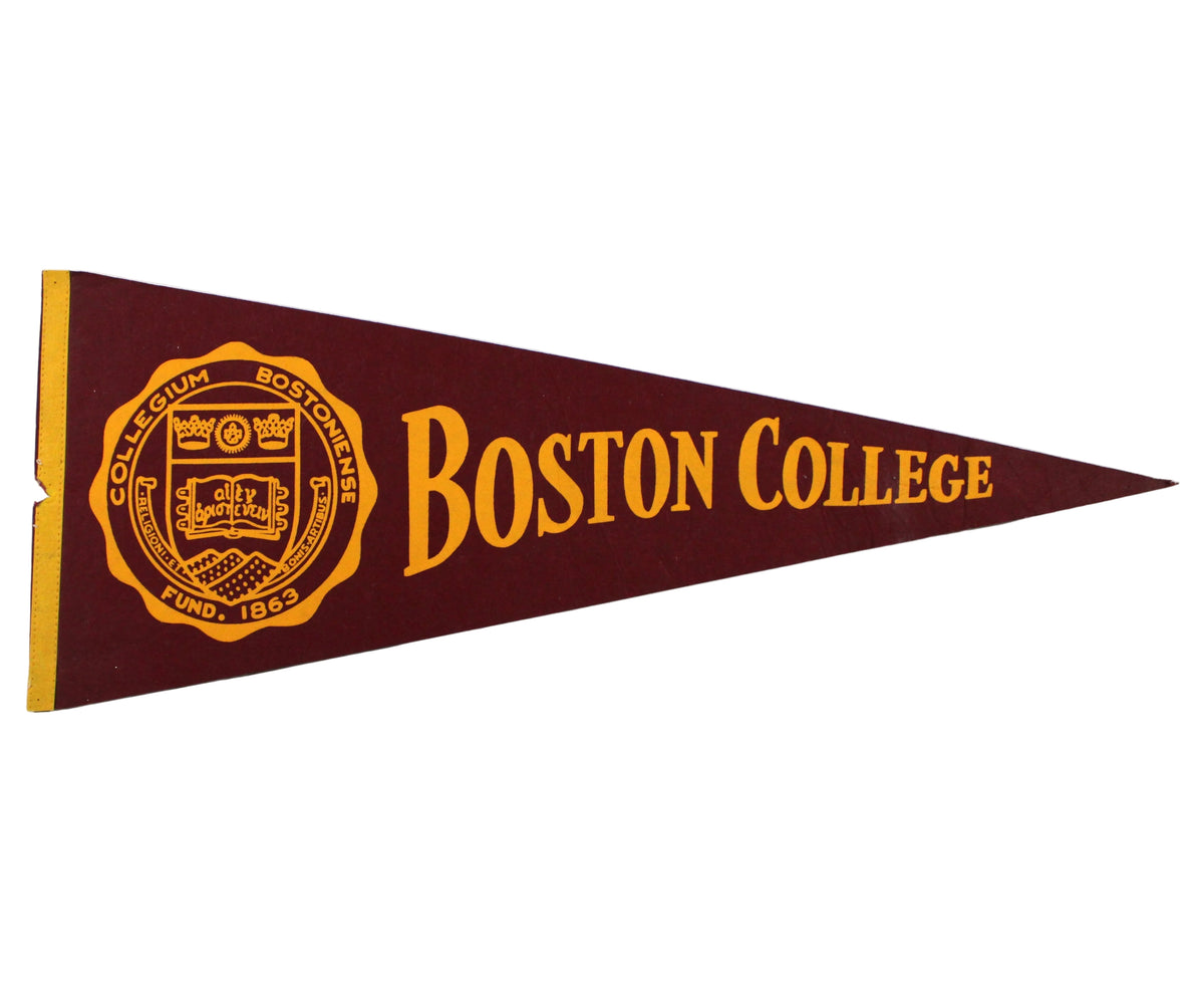 A large vintage triangular Boston College pennant flag in maroon with gold lettering and the school seal