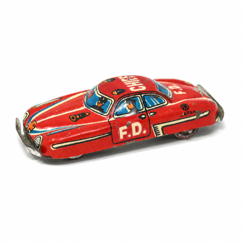 Tiny 1950s Nakamura Japanese tin litho Fire Chief penny toy car.  Red Fire Department Chief car with crew