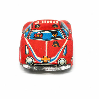 Front view of small 1950s Nakamura Japanese tin litho Fire Chief penny toy car with crew