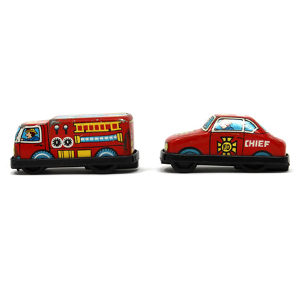 Two vintage mini toy fire department vehicles, a fire engine and a chief car, side by side on a white background.
