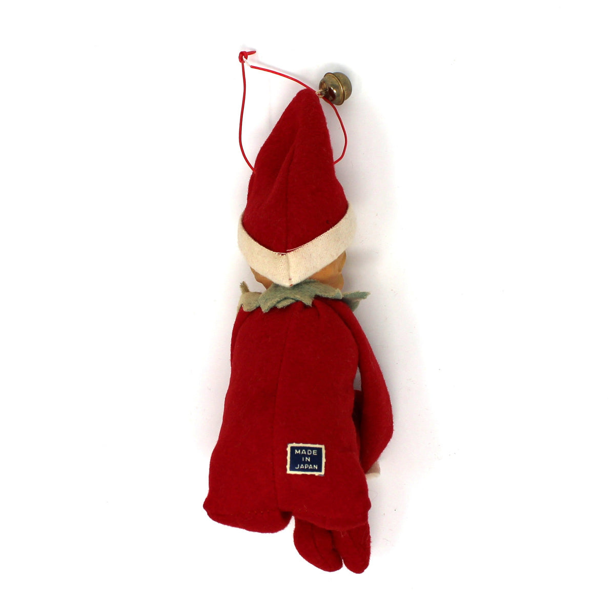 A small red Christmas gnome ornament made from a red knit glove, with a cream-colored face and a green leafy collar, hanging against a plain white background.