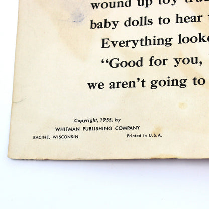 A close-up of a vintage children's book page with printed text, showing copyright 1955 for Whitman Publishing Company, Racine, Wisconsin