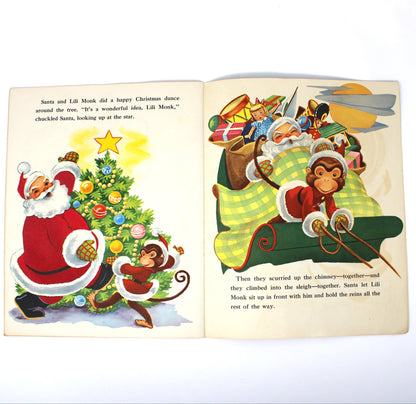 An open vintage children's book spread showing a Christmas-themed illustration with Santa Claus, a monkey, gifts, and text on both pages.