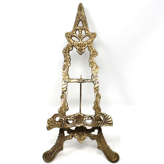 An ornate vintage brass tabletop  display easel stand.