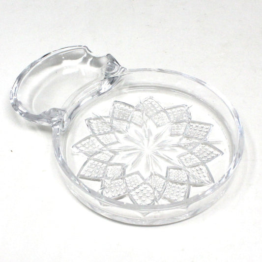 Vintage Fostoria Coaster.  Clear crystal coaster with a Poinsettia flower design and a spoon rest extension.