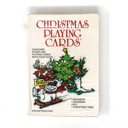 A vintage deck of Christmas playing cards in a small white box with red title text and an illustration of Santa Claus and a Christmas tree.