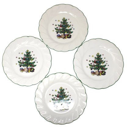 A set of Four vintage ironstone salad plates, NIKKO Happy Holidays Christmas pattern with scalloped edges, each decorated with a colorful Christmas tree and presents.