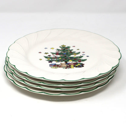 a stack of four vintage NIKKO Happy Holidays Christmas salad plates.