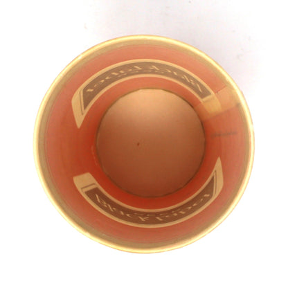A top-down view of a vintage paper cup from Carling Black Label Beer.  