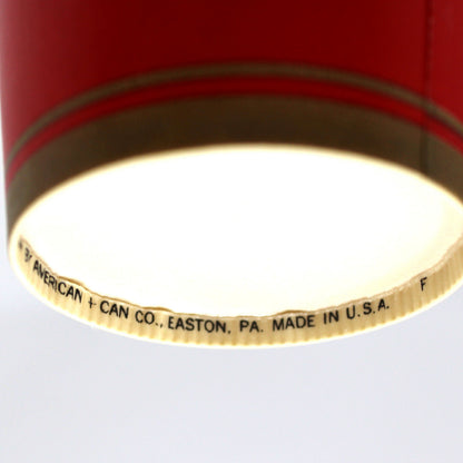 A close-up of the underside of a vintage paper cup, showing a white printed text that reads 'CAN CO. EASTON, PA., MADE IN U.S.A.