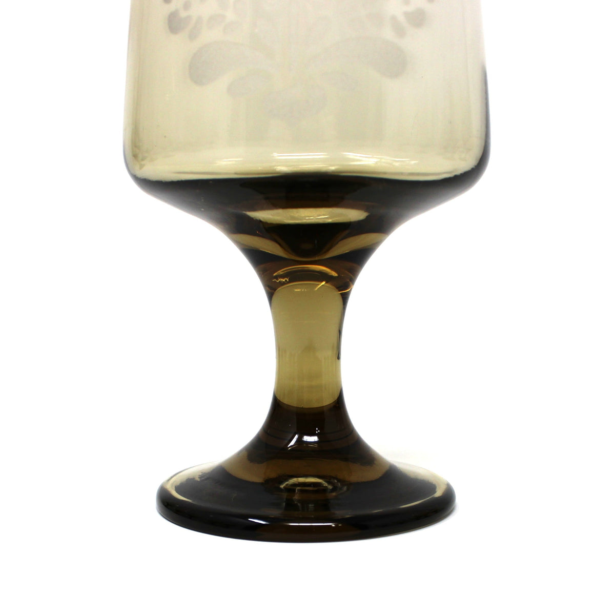 close up view of stem from vintage water goblet in the Village pattern, smoke brown glass