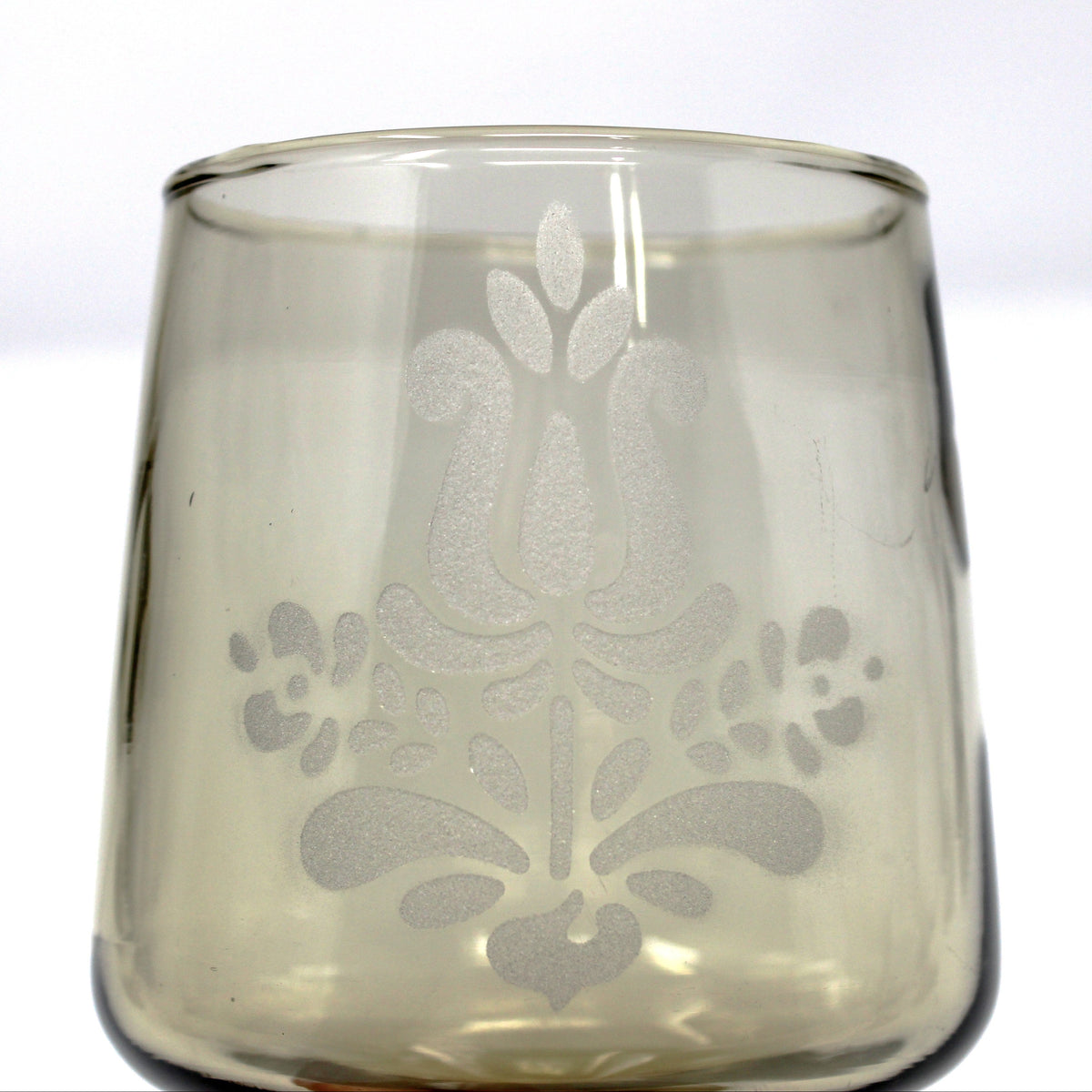 close up view of the etched floral pattern on vintage water goblet from Pfaltzgraff in the Village pattern.