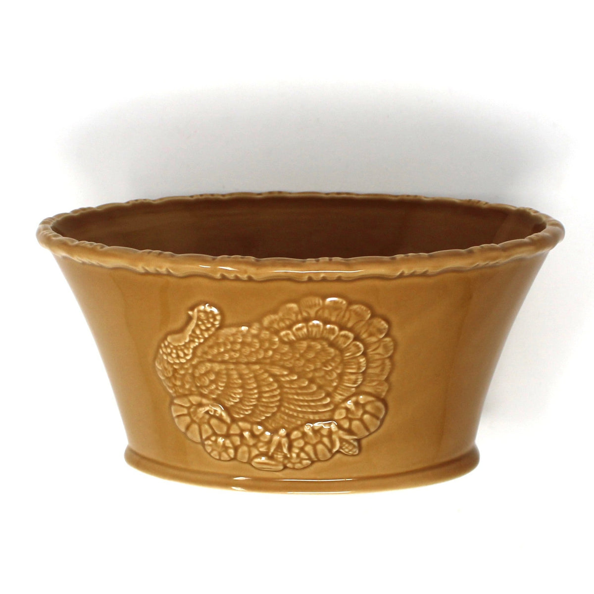 Ceramic oval bowl with embossed turkey in a yellow or mustard brown color.