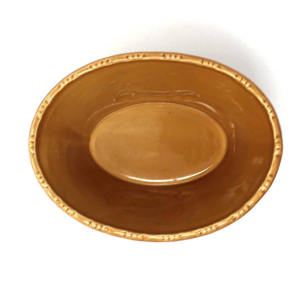 view of the inside of a Hallmark ceramic oval bowl with embossed turkey